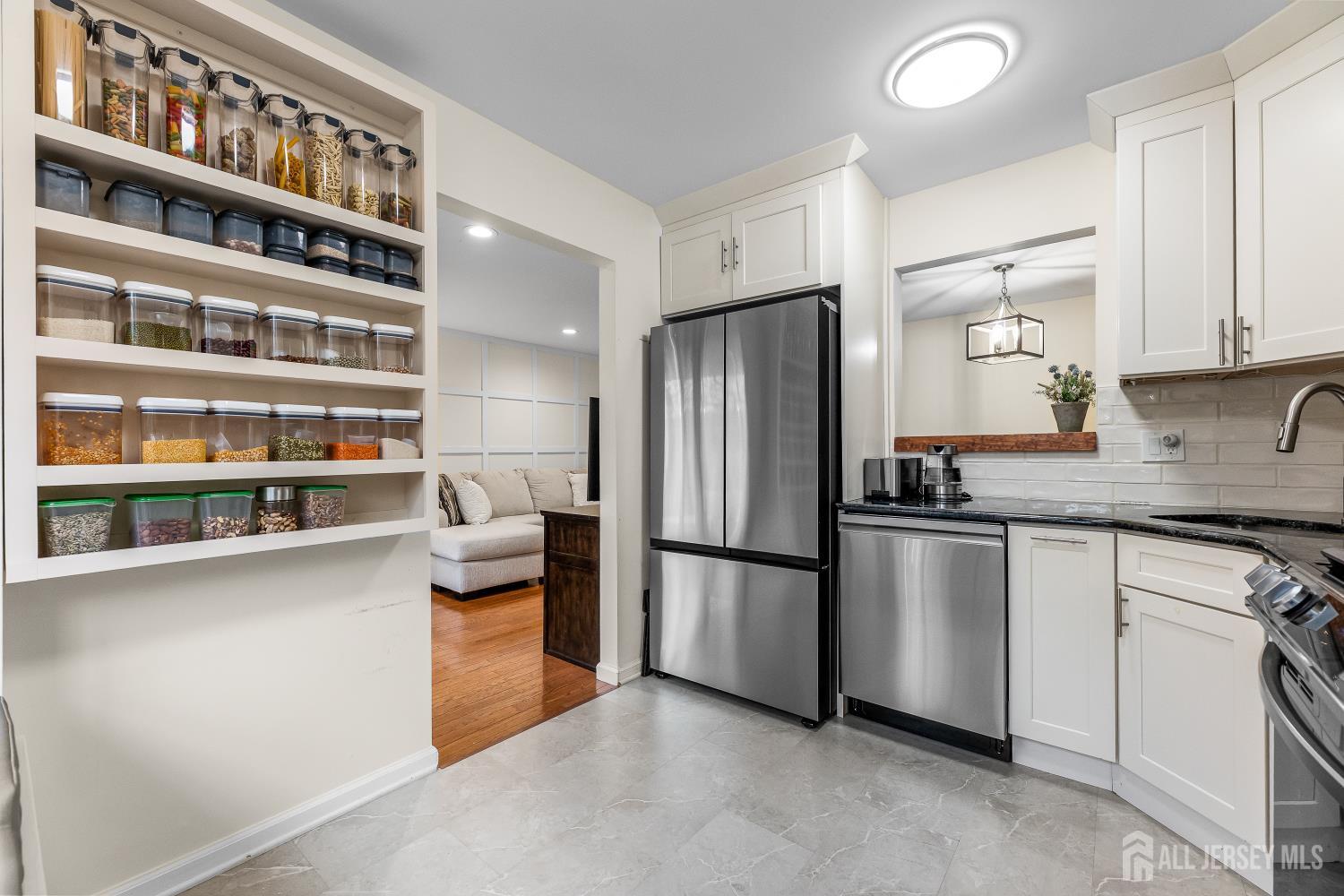 7 Edith Drive Somerset, NJ 08873 - Photo 13 of 49 a kitchen with stainless steel appliances granite countertop a refrigerator a stove and a sink