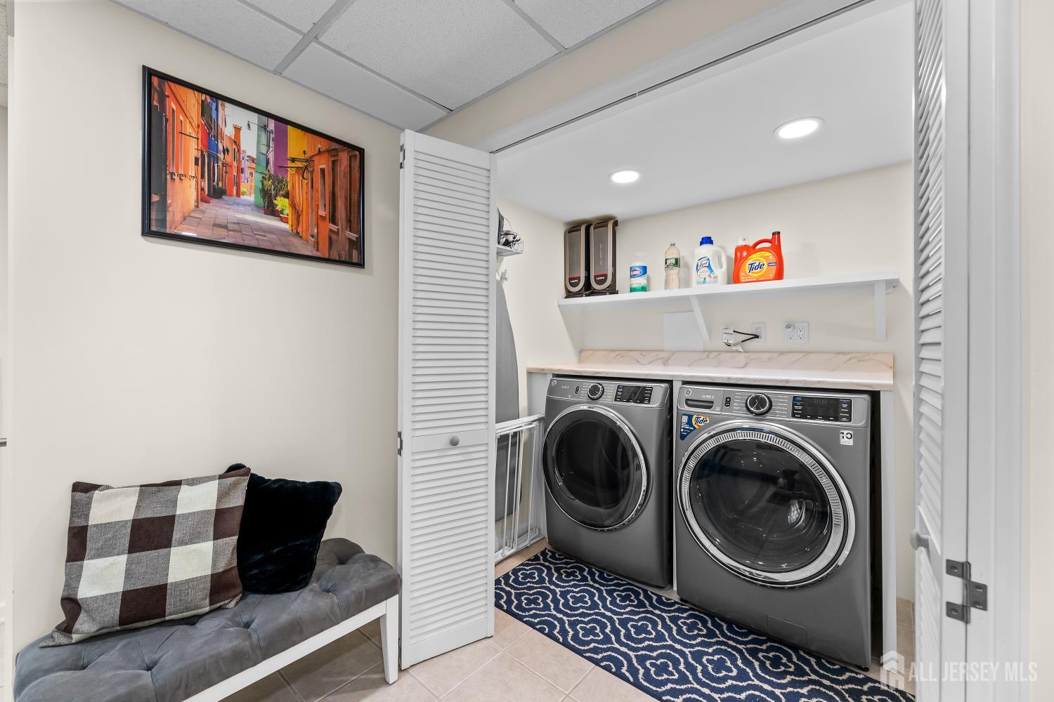 7 Edith Drive Somerset, NJ 08873 - Photo 29 of 49 a living room with furniture and a bookshelf