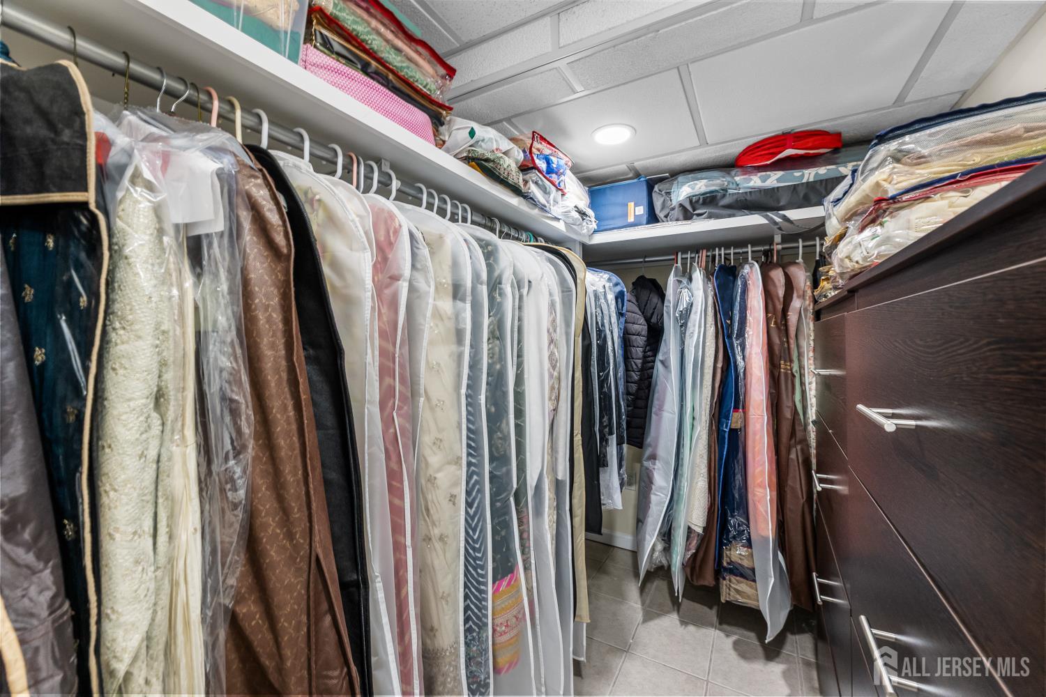 7 Edith Drive Somerset, NJ 08873 - Photo 45 of 49 a view of walk in closet with clothes