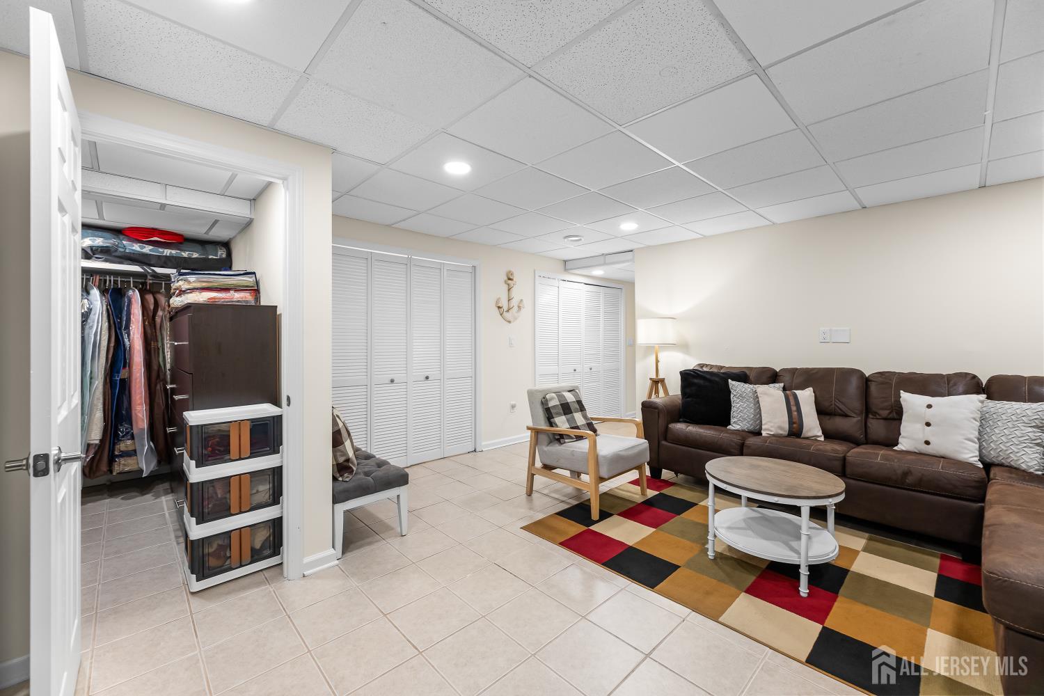 7 Edith Drive Somerset, NJ 08873 - Photo 46 of 49 a living room with furniture gym equipment and a rug