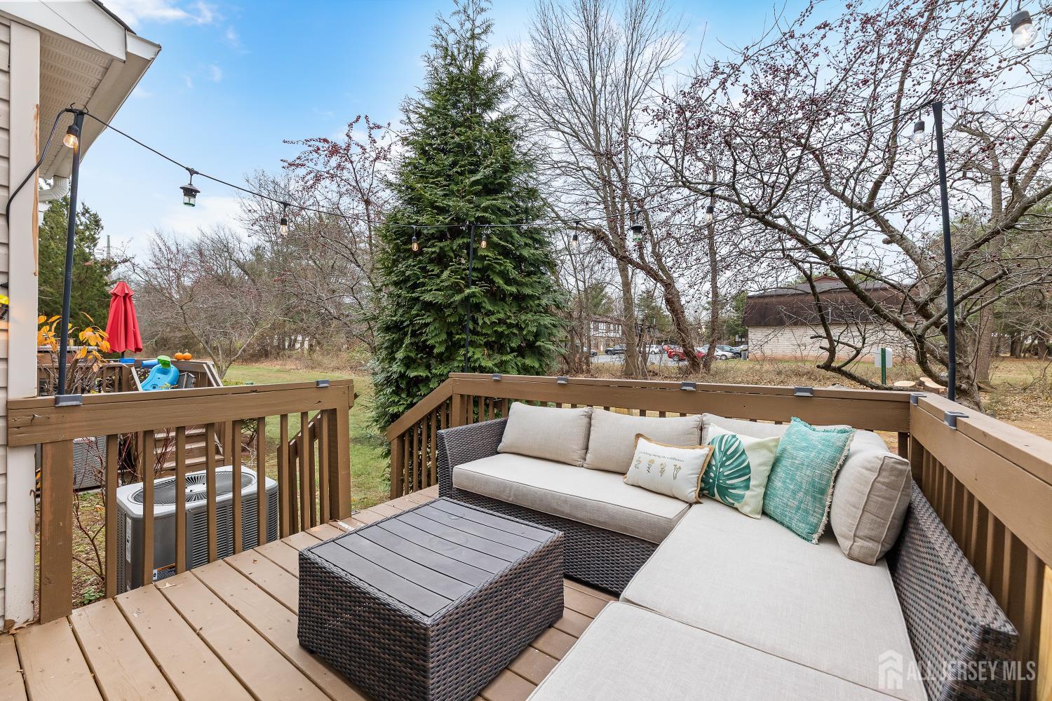 7 Edith Drive Somerset, NJ 08873 - Photo 7 of 49 a roof deck with couches and wooden floor