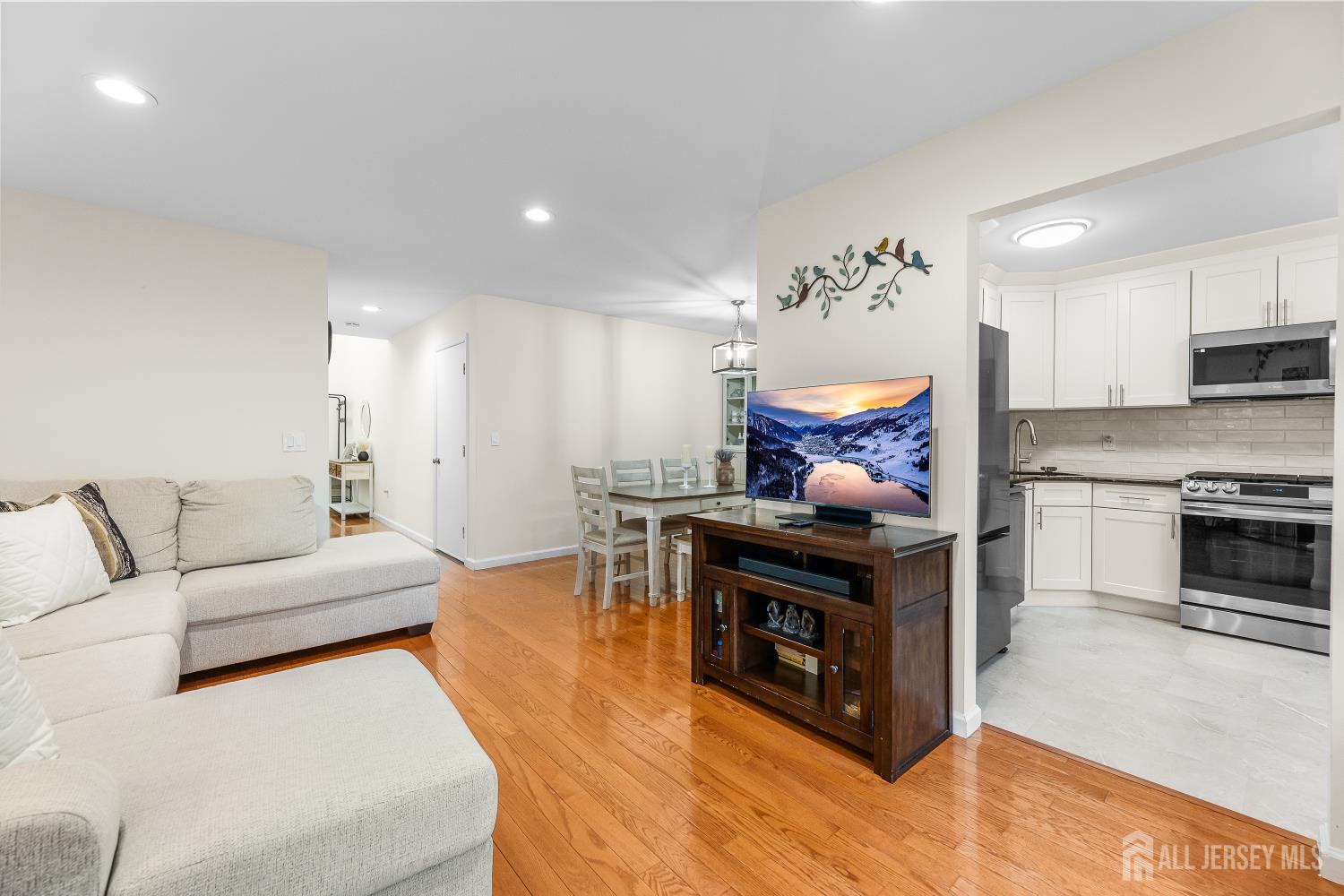 7 Edith Drive Somerset, NJ 08873 - Photo 9 of 49 a living room with furniture and a fireplace