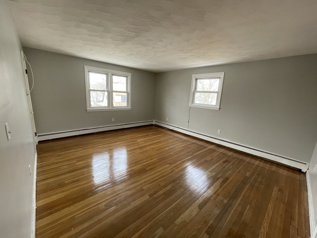 72 Longfellow Road Worcester, MA 01602 - Photo 19 of 36 a view of room with window and wooden floor