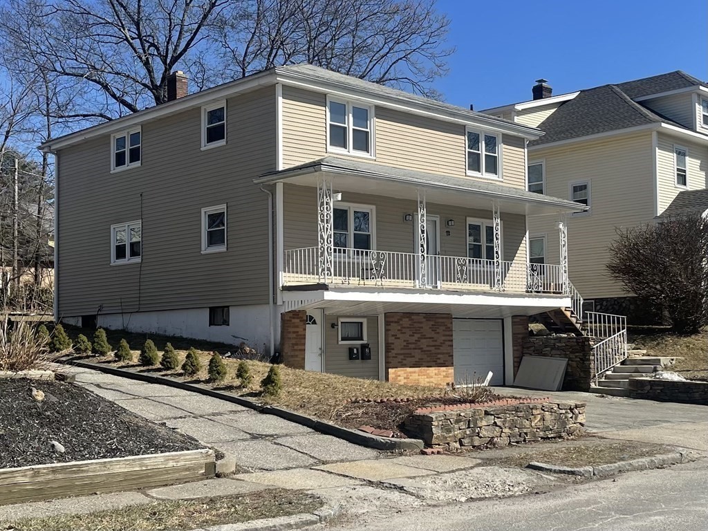 72 Longfellow Road Worcester, MA 01602 - Photo 34 of 36 a front view of a house with a yard