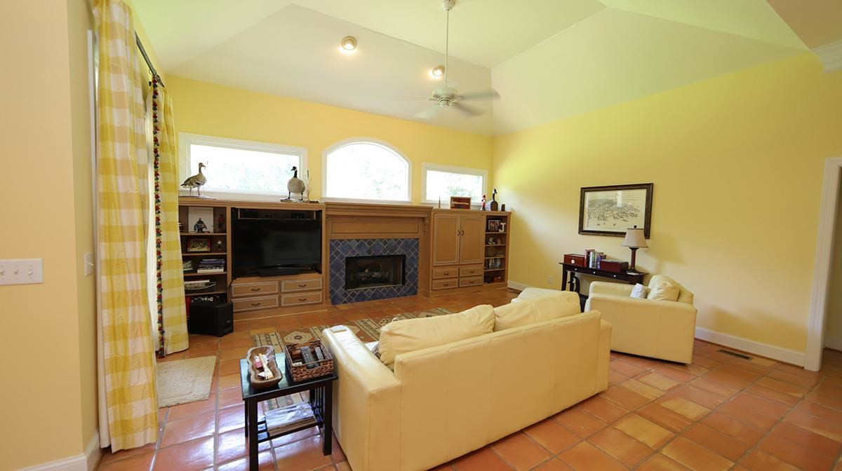 5817 Stone Spring Road Raleigh, NC 27613 - Photo 8 of 28 Saltillo Custom Tile Flooring Makes for Easy Cleaning and a Tropical Feel. Family Room