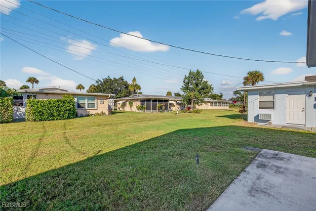 a view of a house with a big yard
