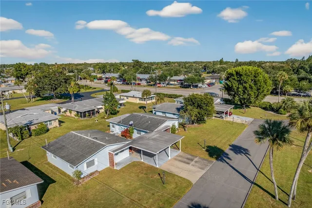an aerial view of residential houses with outdoor space