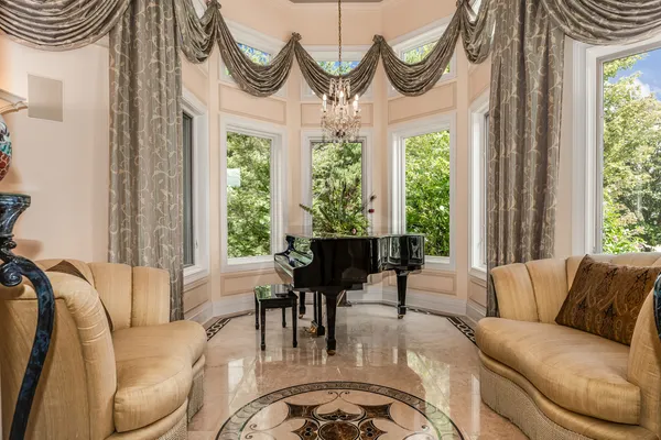 a living room with fireplace furniture and decor
