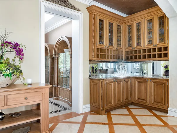 a kitchen with kitchen island a counter top space a sink stainless steel appliances and cabinets