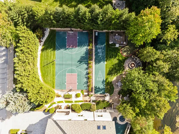 a backyard of a house with outdoor seating and plants