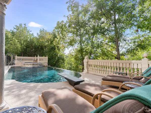a view of a yard with couches chairs