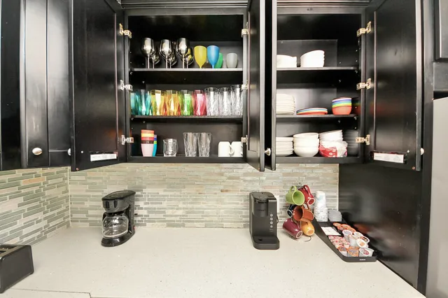 a living room with furniture fireplace and window