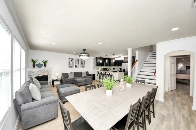 a bedroom with a large bed and a couch