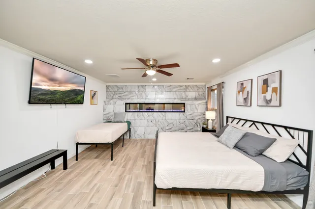 a kitchen with a sink cabinets and wooden floor