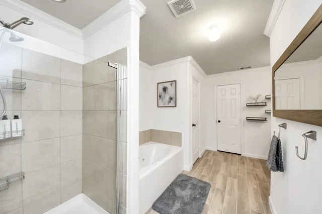 a bathroom with double vanity sink and a mirror