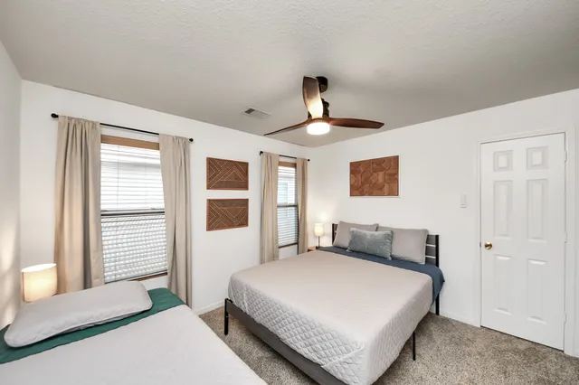 a bedroom with a bed and a table