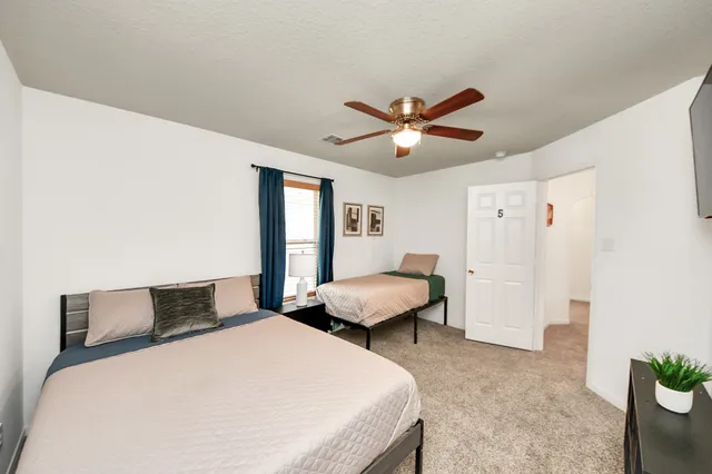 a bathroom with a double vanity sink and mirror