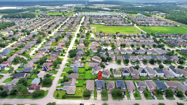a view of a backyard with sitting area