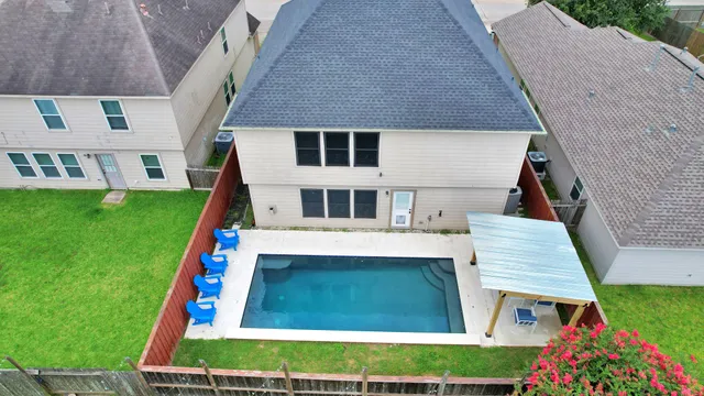 a view of a patio with a table and chairs