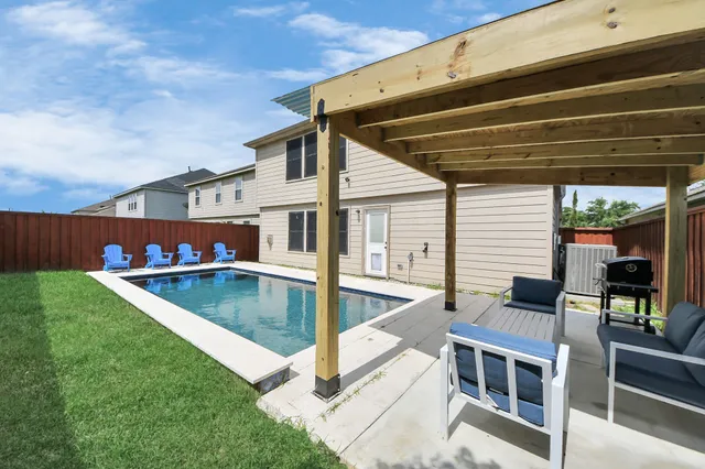 a view of an house with a swimming pool