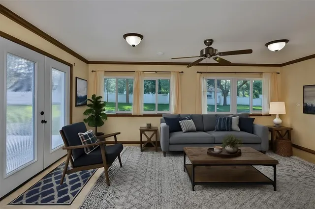 a living room with furniture and a large window