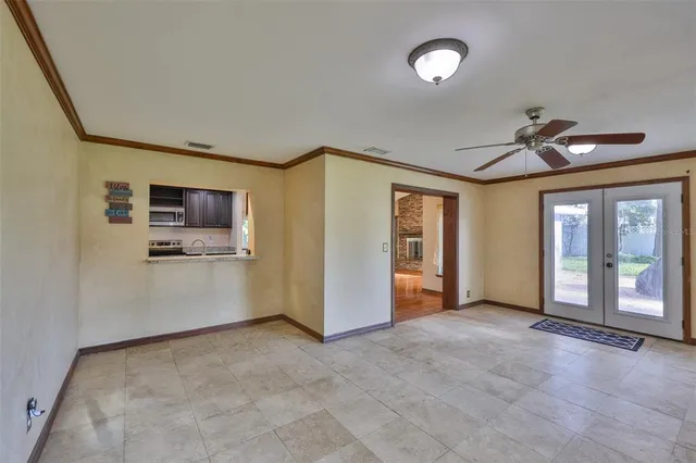 a view of a big room with windows and cabinet