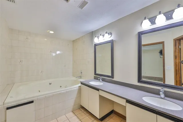 a bathroom with a bathtub and a sink