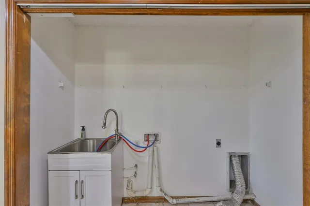 a bathroom with a sink mirror and vanity