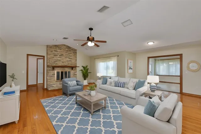 a living room with furniture and a fireplace