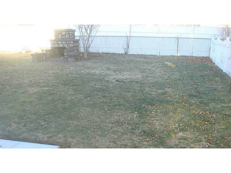 65 Fairfield Road Cranston, RI 02910 - Photo 6 of 20 Exterior Back. PVC, FENCED-IN YARD/OUTDOOR FIREPLACE