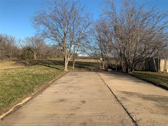 a view of a yard with an ocean view