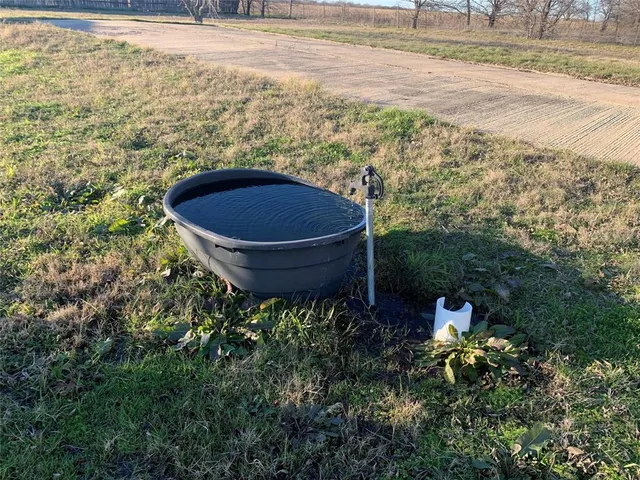 a view of a lake with a big yard