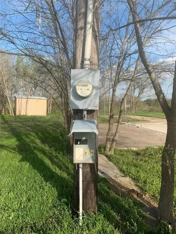 a view of a backyard with large trees