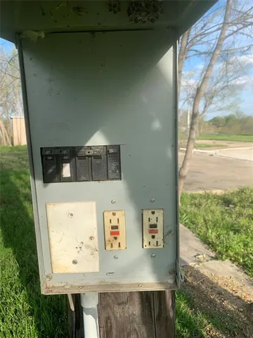 a view of a two chairs in the backyard