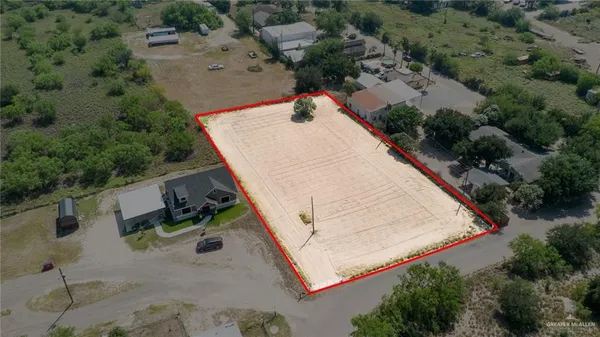 an aerial view of houses with yard