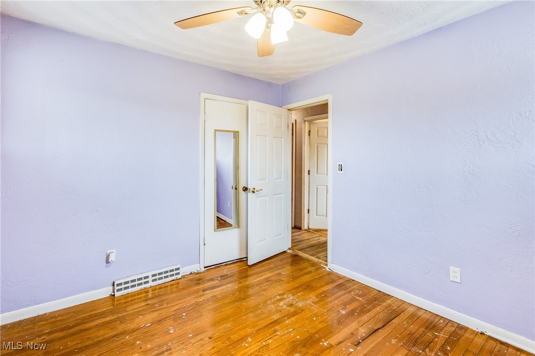 50251 Smith Road Negley, OH 44441 - Photo 25 of 48 Unfurnished living room with carpet, ceiling fan, a textured wall, and beamed ceiling