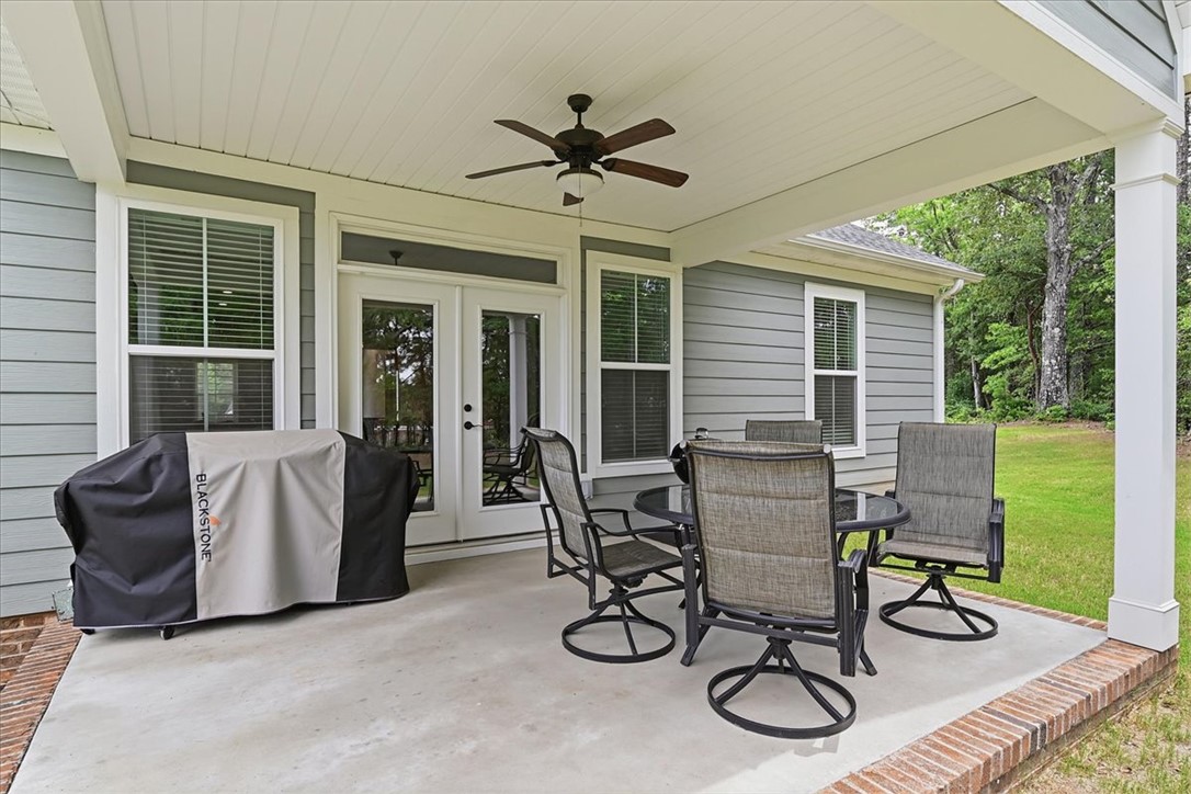 214 Timothy Court Anderson, SC 29621 - Photo 35 of 43 An inviting covered patio with a ceiling fan, perfect for relaxed outdoor gatherings.
