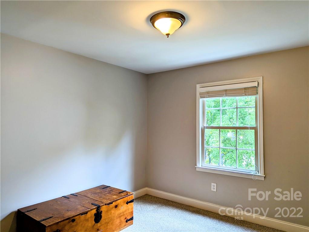 4915 Park Road, Unit C Charlotte, NC 28209 - Photo 16 of 22 an empty room with a window