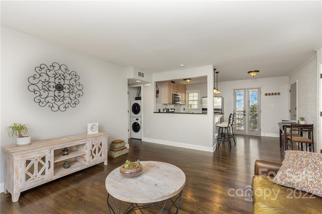 4915 Park Road, Unit C Charlotte, NC 28209 - Photo 2 of 22 a living room with furniture and wooden floor