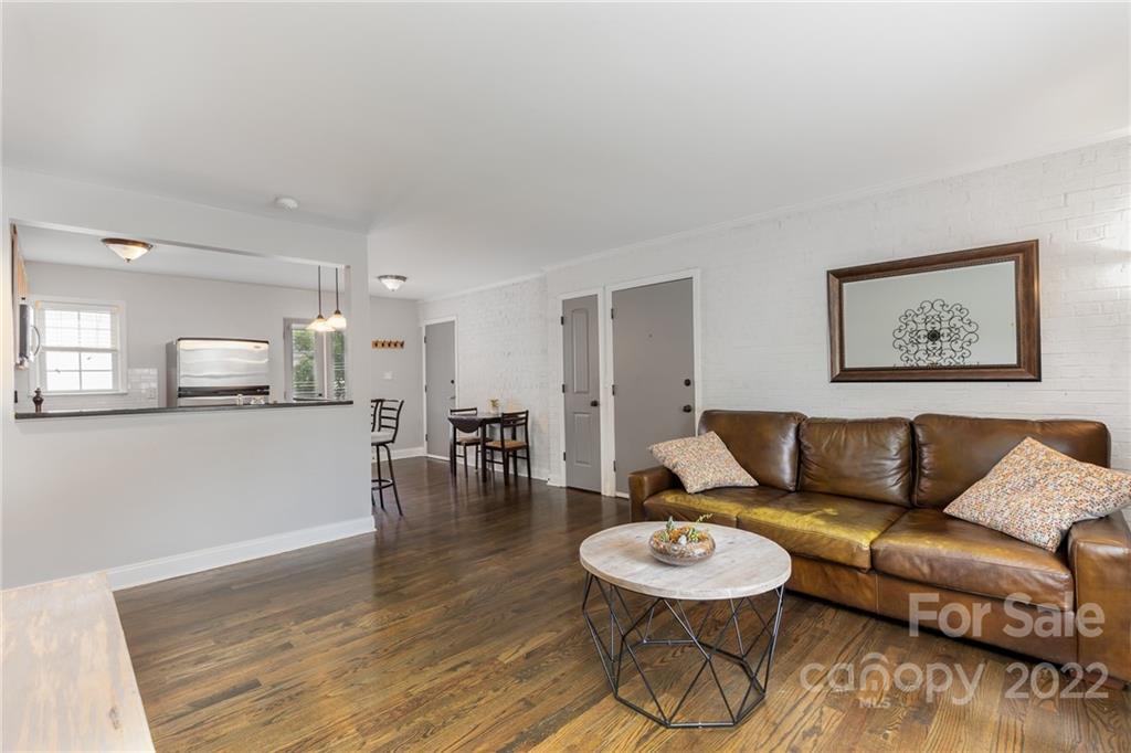 4915 Park Road, Unit C Charlotte, NC 28209 - Photo 7 of 22 a living room with furniture and kitchen view
