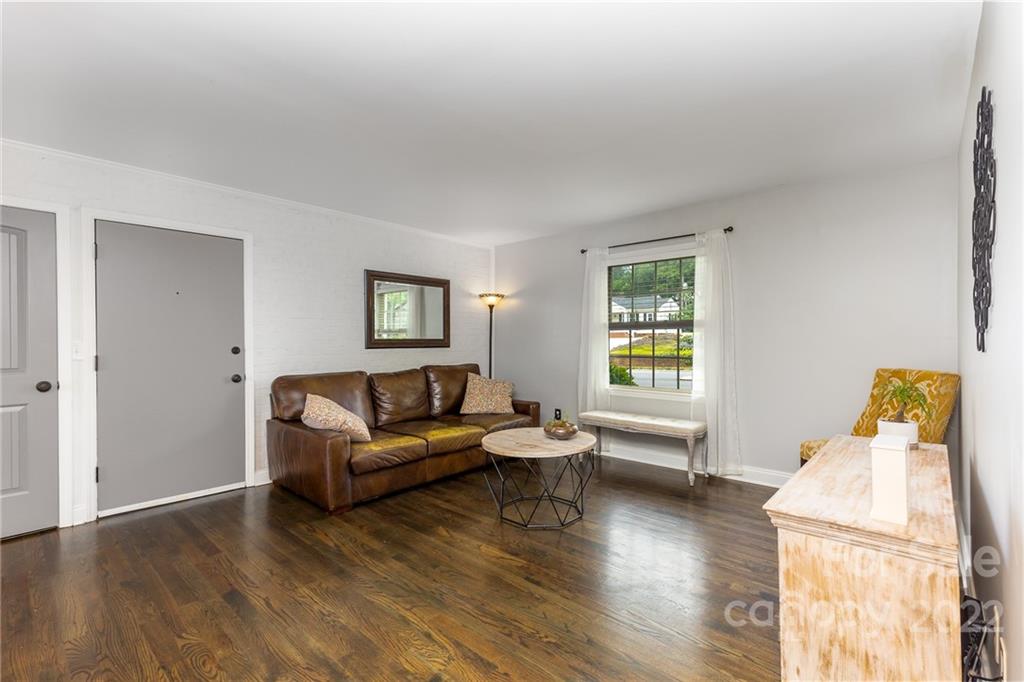 4915 Park Road, Unit C Charlotte, NC 28209 - Photo 9 of 22 a living room with furniture and a wooden floor