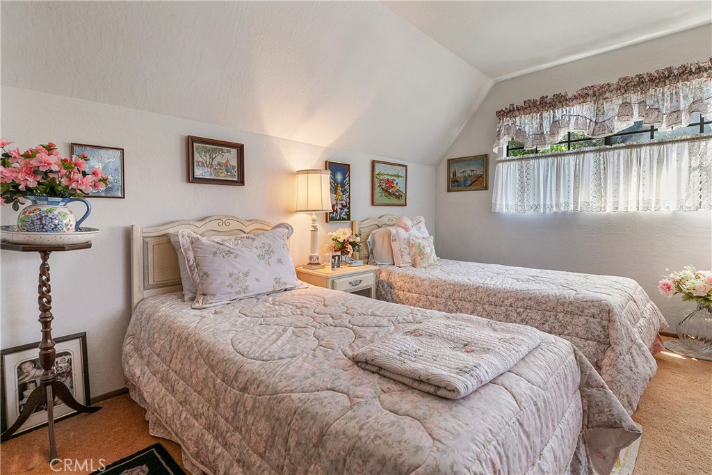 329 Grass Valley Road Lake Arrowhead, CA 92352 - Photo 17 of 31 a bedroom with a bed and a window