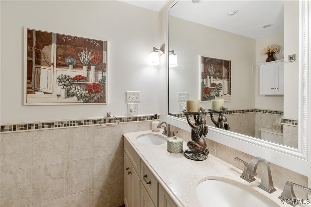 281 Echo Meadows Road Rockville, VA 23146 - Photo 15 of 50 a bathroom with a double vanity sink and a mirror