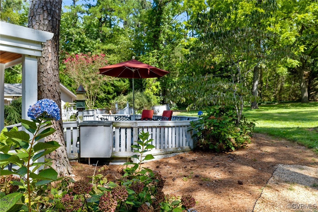 281 Echo Meadows Road Rockville, VA 23146 - Photo 37 of 50 a view of a porch with furniture and a garden