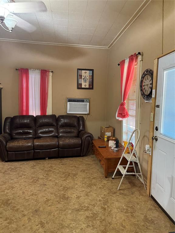 414 East Harris Dublin, TX 76446 - Photo 4 of 10 a room with furniture and a window