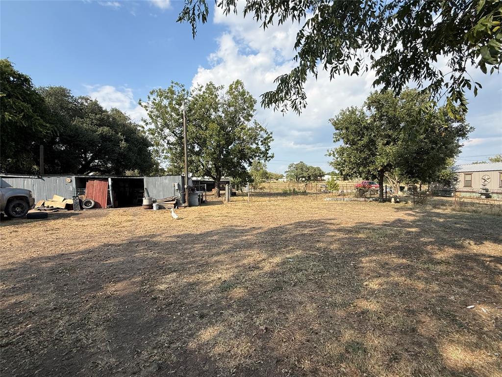 414 East Harris Dublin, TX 76446 - Photo 10 of 10 a view of road with large trees