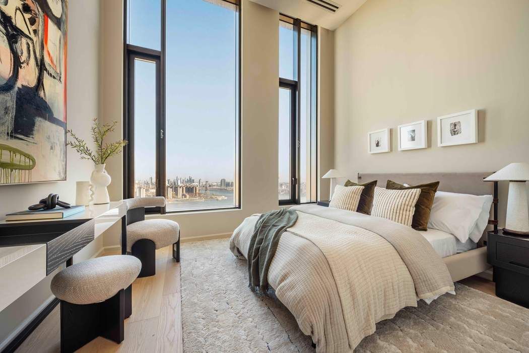 30 Front Street, Unit PHB Brooklyn, NY 11201 - Photo 11 of 42 a bed sitting in a bedroom next to a window