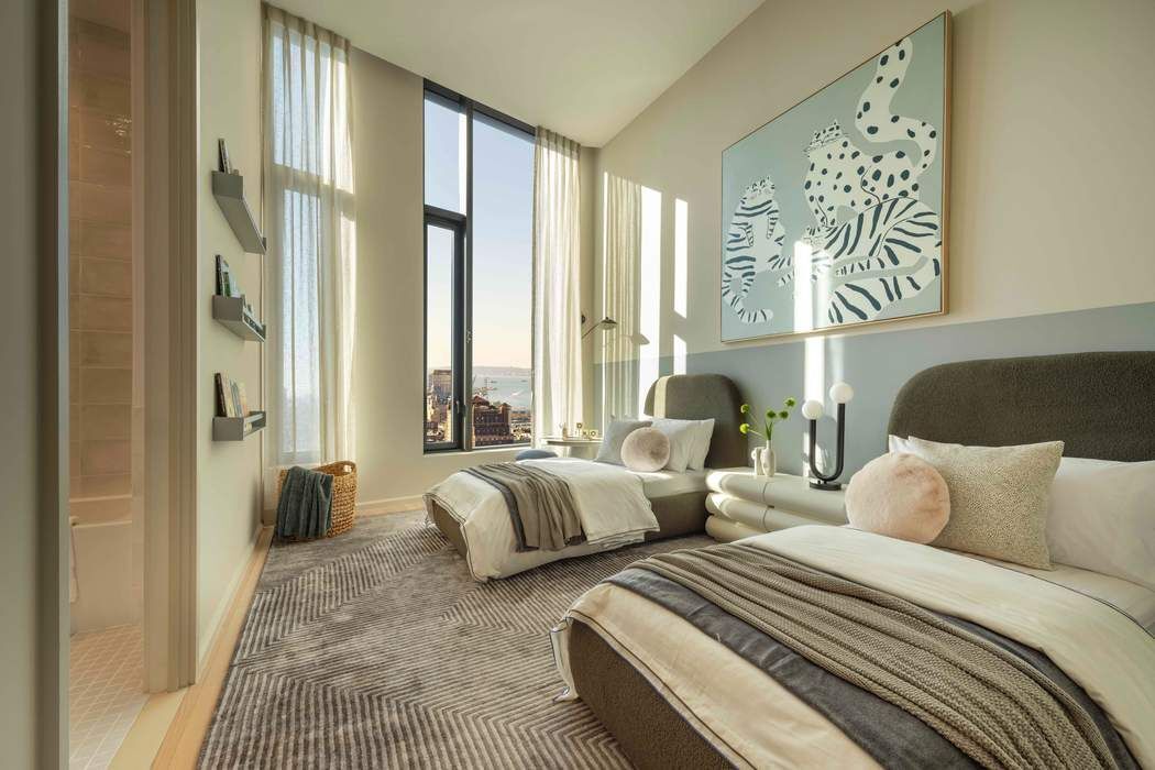 30 Front Street, Unit PHB Brooklyn, NY 11201 - Photo 13 of 42 a bedroom with two beds and a large mirror next to a window