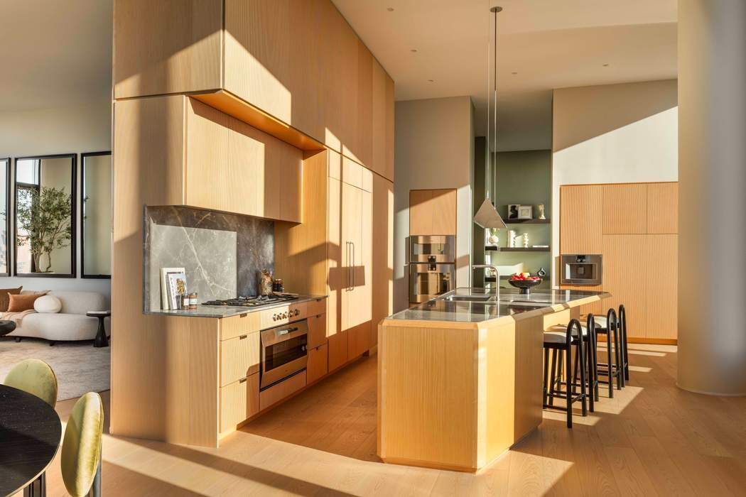 30 Front Street, Unit PHB Brooklyn, NY 11201 - Photo 5 of 42 a open kitchen with stainless steel appliances granite countertop a stove and a refrigerator
