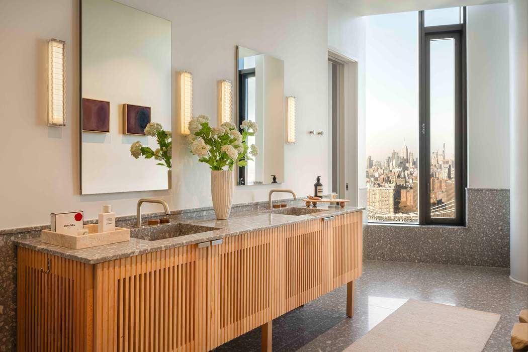 30 Front Street, Unit PHB Brooklyn, NY 11201 - Photo 9 of 42 a bathroom with a granite countertop sink and a large mirror